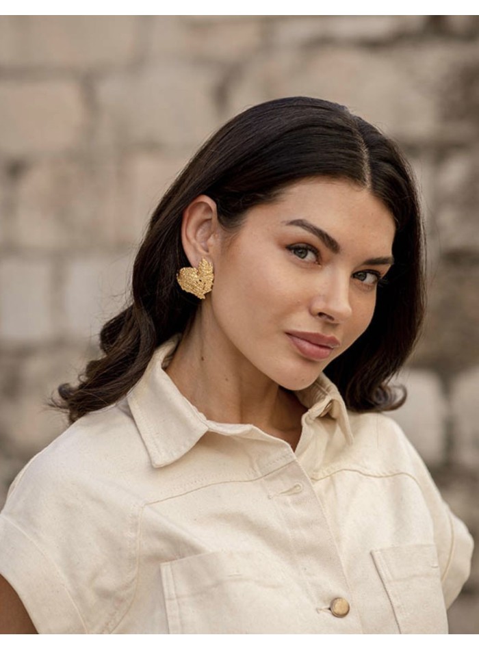 Boucles d'oreilles de fête en or avec relief