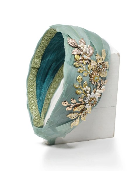 Headband with feather base and golden jewel detail