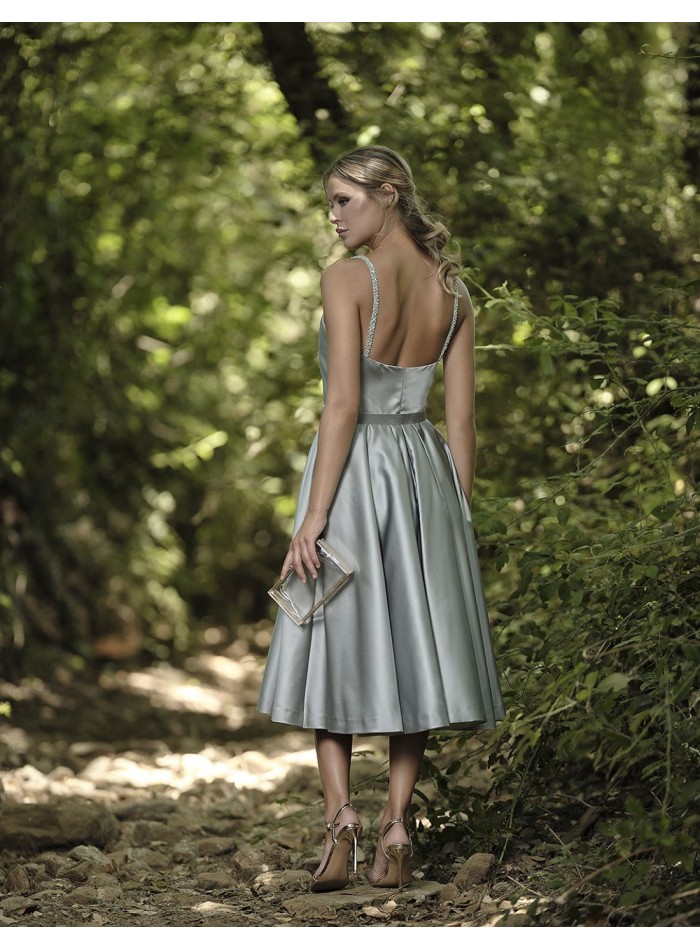 Short ball gown with a slatted skirt and...