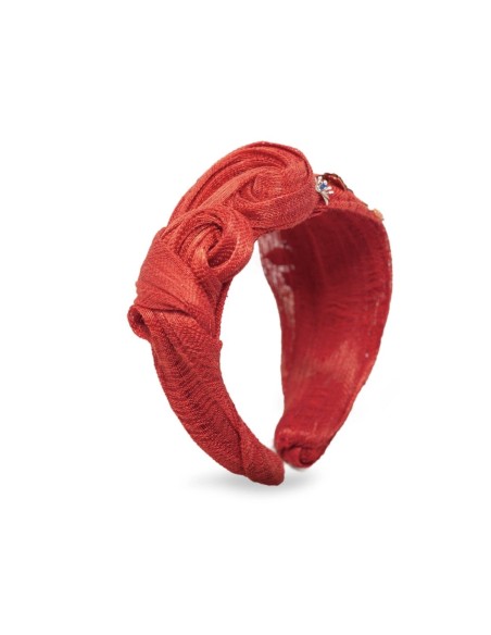 Diadema anudada con adornos joya y pistilos