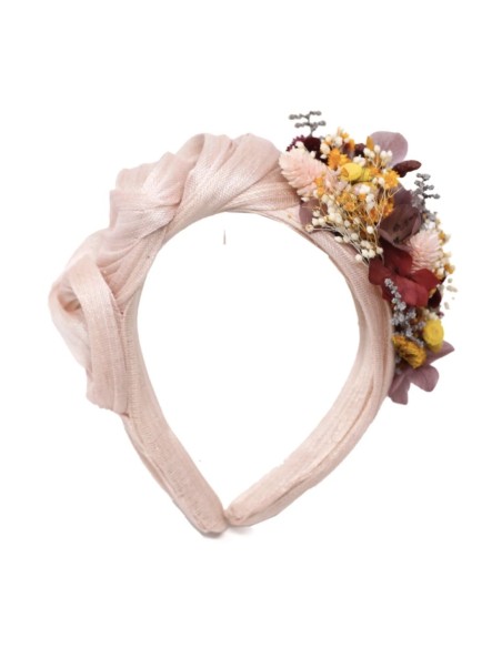 Bandeau de fête à volants avec nœuds et décoration florale sur le côté