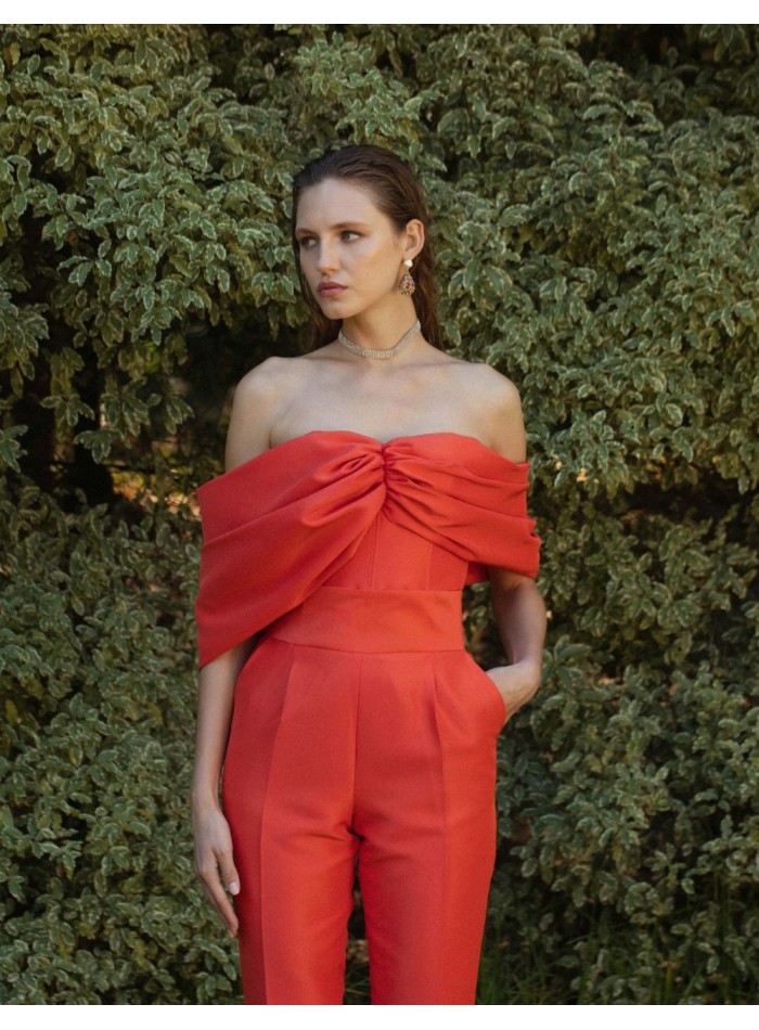 Draped crop top with strapless neckline in bright orange.