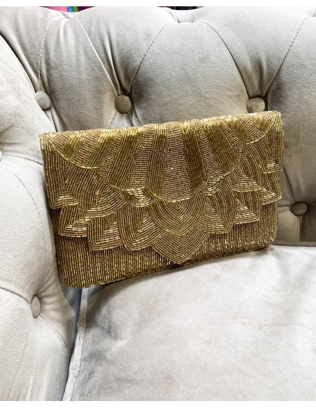 Pochette en strass doré pour les invités