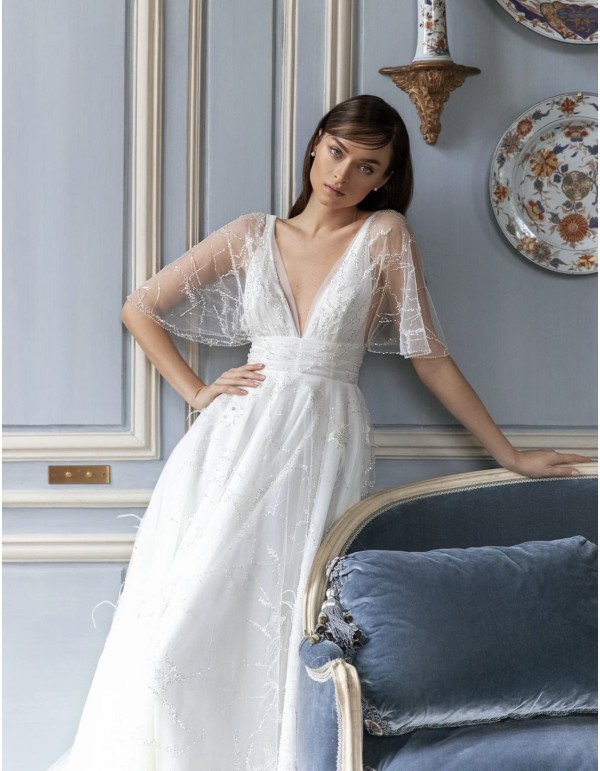 Wedding dress with sheer short sleeves and flowing skirt 2