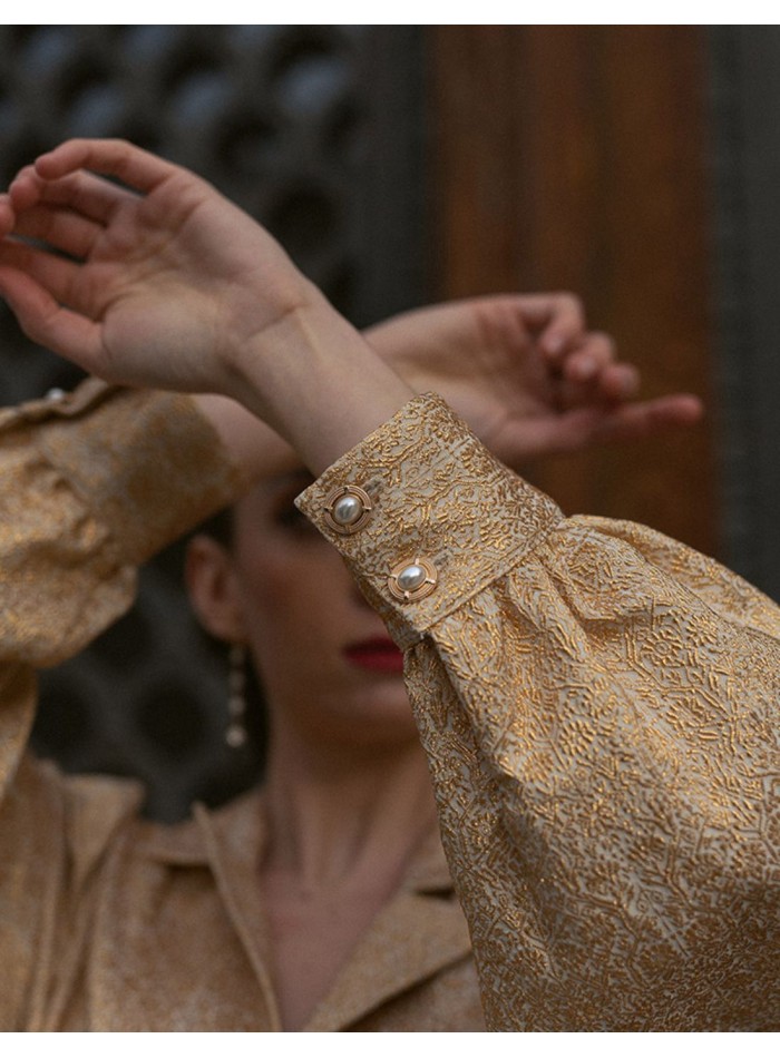 Golden printed party blouse with puffed sleeves