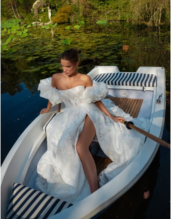 Ivory A-line wedding dress with a straight neckline,...