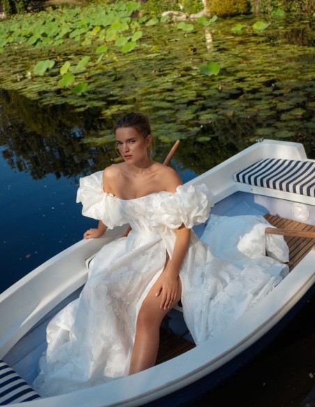 Ivory A-line wedding dress with a straight neckline, V-back and slit