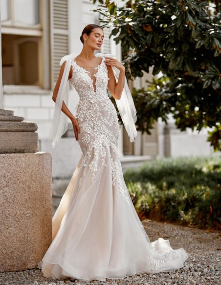Nude wedding dress with V-neckline and V-back, lace and bows