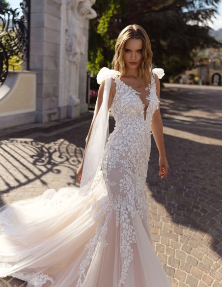 Nude wedding dress with V-neckline and V-back, lace and bows