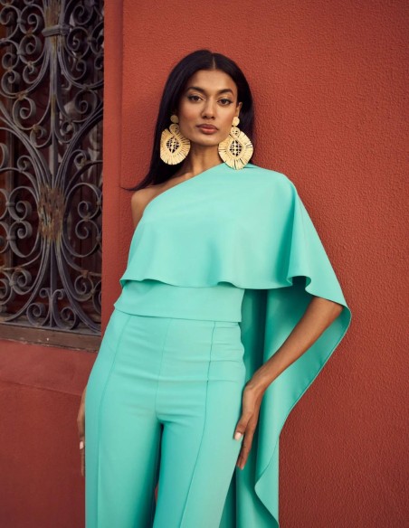 Asymmetric party top with asymmetric cape.