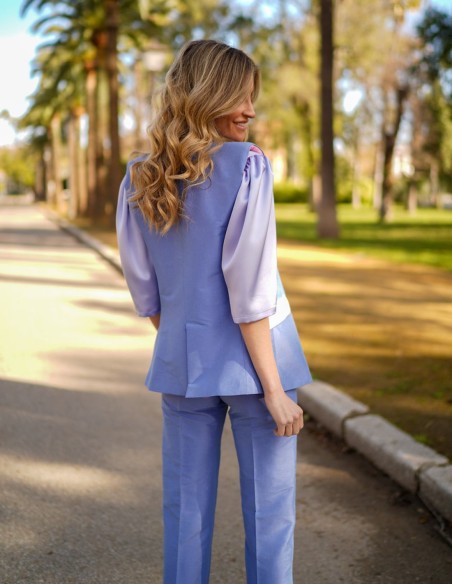 Sleeveless silk vest with lined pockets and buttons