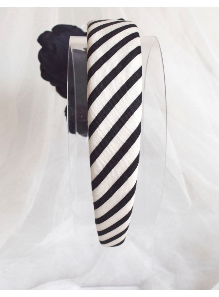 Striped headband with black flower appliqué...