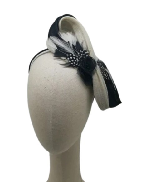 Black and white lace headdress with feather appliqués