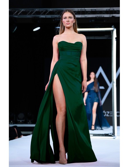 Long green evening dress with high neckline and high leg slit