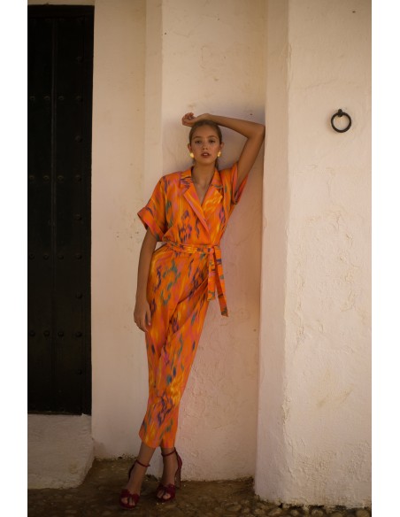 Printed party jumpsuit with raglan sleeves and tuxedo neckline