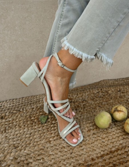 Green party sandal with straps tied at the ankle