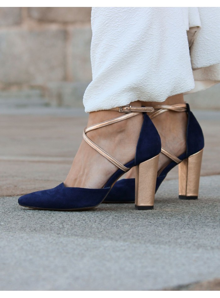 Navy blue suede pumps with gold details