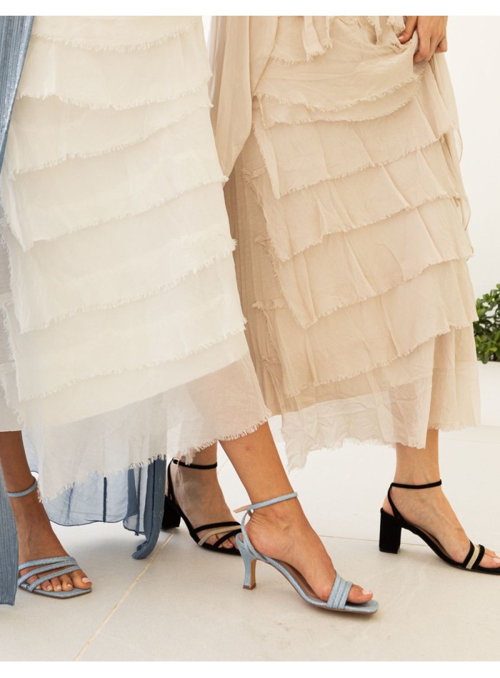 Blue party sandal with straps tied at the ankle