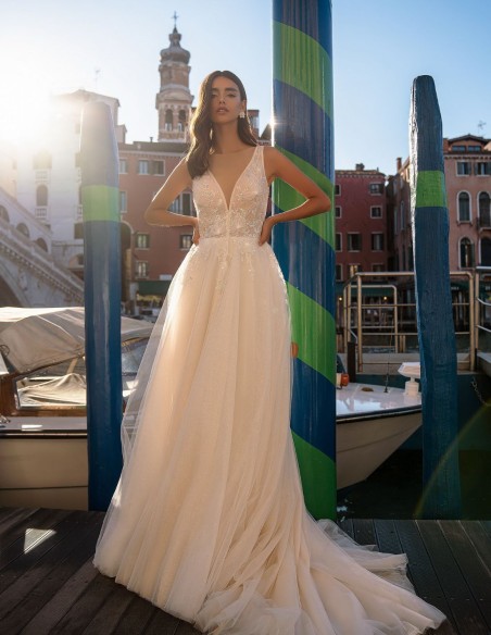 Ivory long wedding dress with V-neckline and beaded bodice