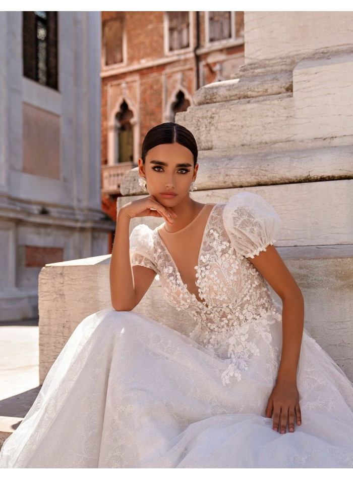 Long wedding dress in floral embroidered tulle...