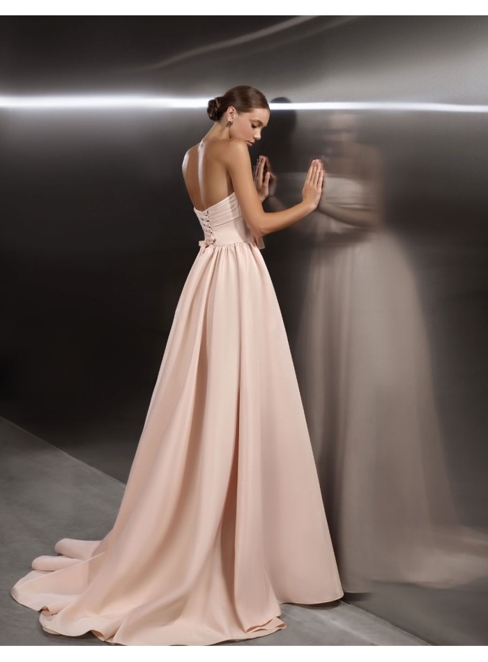 Long party gown with a knotted strapless...